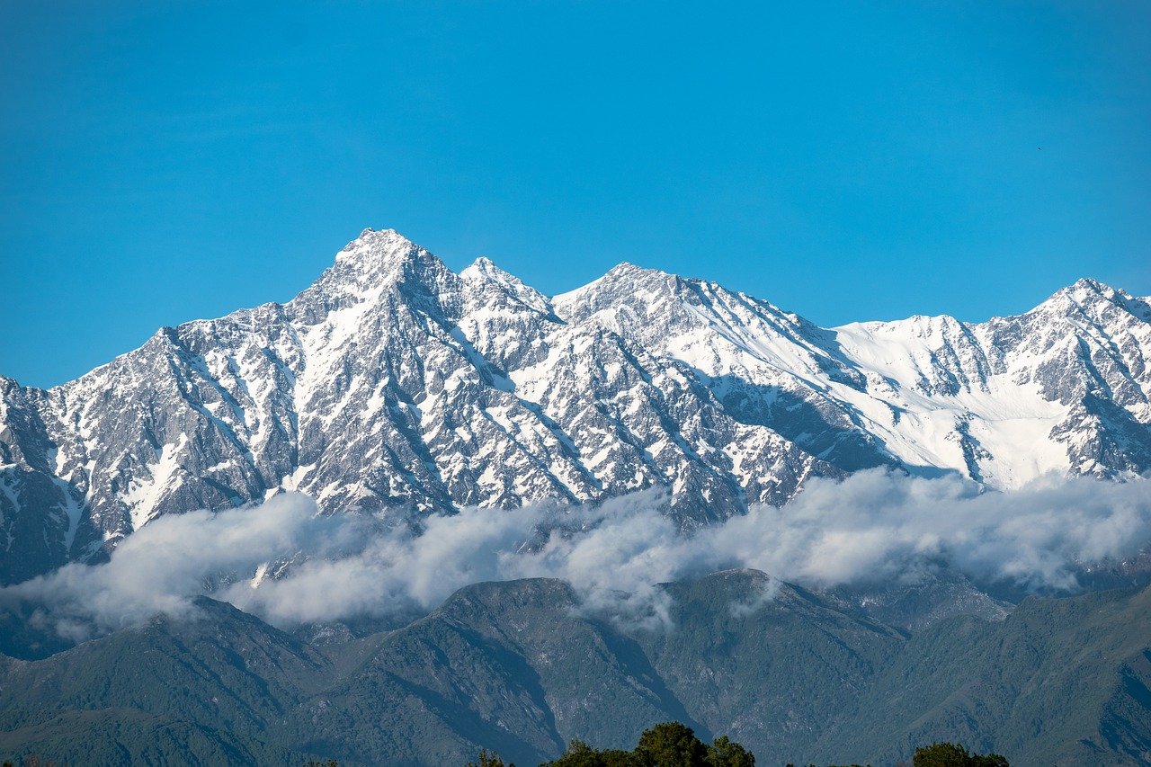 Introduction: Introduce the Concept: Highlight that while India is known for its iconic trekking destinations like Manali, Leh, and the Himalayas, there are many lesser-known trails that offer a more tranquil, authentic experience. Appeal to Adventurers: Encourage readers who seek adventure beyond the well-trodden tourist paths to explore these hidden gems, where nature and culture remain untouched by mass tourism. 1. Tirthan Valley, Himachal Pradesh Overview: A hidden gem in the Himalayas, Tirthan Valley is known for its scenic beauty, crystal-clear rivers, and quaint villages. Trekking Experience: Trails around the Great Himalayan National Park offer a peaceful escape with dense forests, wildlife sightings, and picturesque waterfalls. Why It’s Special: A less commercialized area, perfect for trekkers who love nature, serenity, and remote landscapes. 2. Kanha National Park, Madhya Pradesh Overview: Famous for its wildlife, this park offers treks that let you explore the heart of the jungle away from the typical safari routes. Trekking Experience: Guided treks through dense forests provide an immersive experience in the habitat of tigers, leopards, and other wildlife. Why It’s Special: For wildlife enthusiasts and those looking for a combination of adventure and nature. 3. Sandakphu, West Bengal Overview: Often overshadowed by popular Himalayan treks, Sandakphu is the highest point in West Bengal and offers panoramic views of four of the world’s five highest peaks. Trekking Experience: The Sandakphu-Phalut trek is a moderate challenge and offers breathtaking views of Kanchenjunga, Everest, Lhotse, and Makalu. Why It’s Special: Less crowded and known for its stunning alpine meadows and incredible sunrise views. 4. Chopta, Uttarakhand Overview: Known as "Mini Switzerland," Chopta is a charming destination located amidst oak, deodar, and rhododendron forests. Trekking Experience: Trek to Tungnath, the highest Shiva temple in the world, and continue to Chandrashila peak for panoramic views. Why It’s Special: A perfect spot for trekkers who prefer off-the-beaten-path adventures and a mix of spirituality and natural beauty. 5. Buran Ghati, Himachal Pradesh Overview: A relatively unknown trek that takes you through remote villages, alpine meadows, and glaciers. Trekking Experience: The Buran Ghati trek starts from Janglik and leads to the breathtaking Buran Pass, where trekkers cross snowfields and discover hidden valleys. Why It’s Special: It’s one of the lesser-known treks in Himachal Pradesh, offering a peaceful and pristine trekking experience with stunning mountain views. 6. Phawngpui, Mizoram Overview: Also known as the Blue Mountain, Phawngpui is the highest peak in Mizoram and one of the most scenic treks in the northeastern part of India. Trekking Experience: Dense forests, breathtaking views, and remote, untouched landscapes await trekkers. Why It’s Special: It’s a perfect trek for those seeking to explore India’s beautiful northeast, away from the crowds. 7. The Great Rann of Kutch, Gujarat Overview: Known for the Rann Utsav, the Rann of Kutch is an endless white salt desert that offers an unusual yet fascinating trekking experience. Trekking Experience: Trekking in the Rann is not about elevation but about navigating vast expanses of salt flats, spotting wildlife, and experiencing the unique culture of the Kutch region. Why It’s Special: A completely different trekking experience, focusing on the landscape, culture, and serenity of the desert. 8. Mawlynnong, Meghalaya Overview: Known as Asia's cleanest village, Mawlynnong offers natural beauty as well as cultural experiences, making it an ideal trekking spot. Trekking Experience: The trek here takes you through lush forests, waterfalls, and the living root bridges of the Khasi tribe. Why It’s Special: Its unique ecosystem and the combination of adventure and culture make it a hidden gem for trekkers in Northeast India. 9. Markha Valley, Ladakh Overview: While Ladakh is well-known, Markha Valley remains one of its more secret trekking routes. Trekking Experience: This trek is a moderate to challenging adventure through barren landscapes, high-altitude deserts, and ancient monasteries. Why It’s Special: The trek provides stunning views of snow-capped peaks and an opportunity to experience Ladakhi culture. 10. Goechala Trek, Sikkim Overview: While more popular among seasoned trekkers, Goechala remains an uncommercialized destination offering serene, untouched views of the Kanchenjunga range. Trekking Experience: The trek takes you through dense forests, alpine meadows, and stunning viewpoints that overlook Kanchenjunga. Why It’s Special: Known for its breathtaking views, fewer tourists make it an ideal offbeat trekking destination.