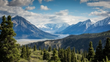 green mountain across body of water